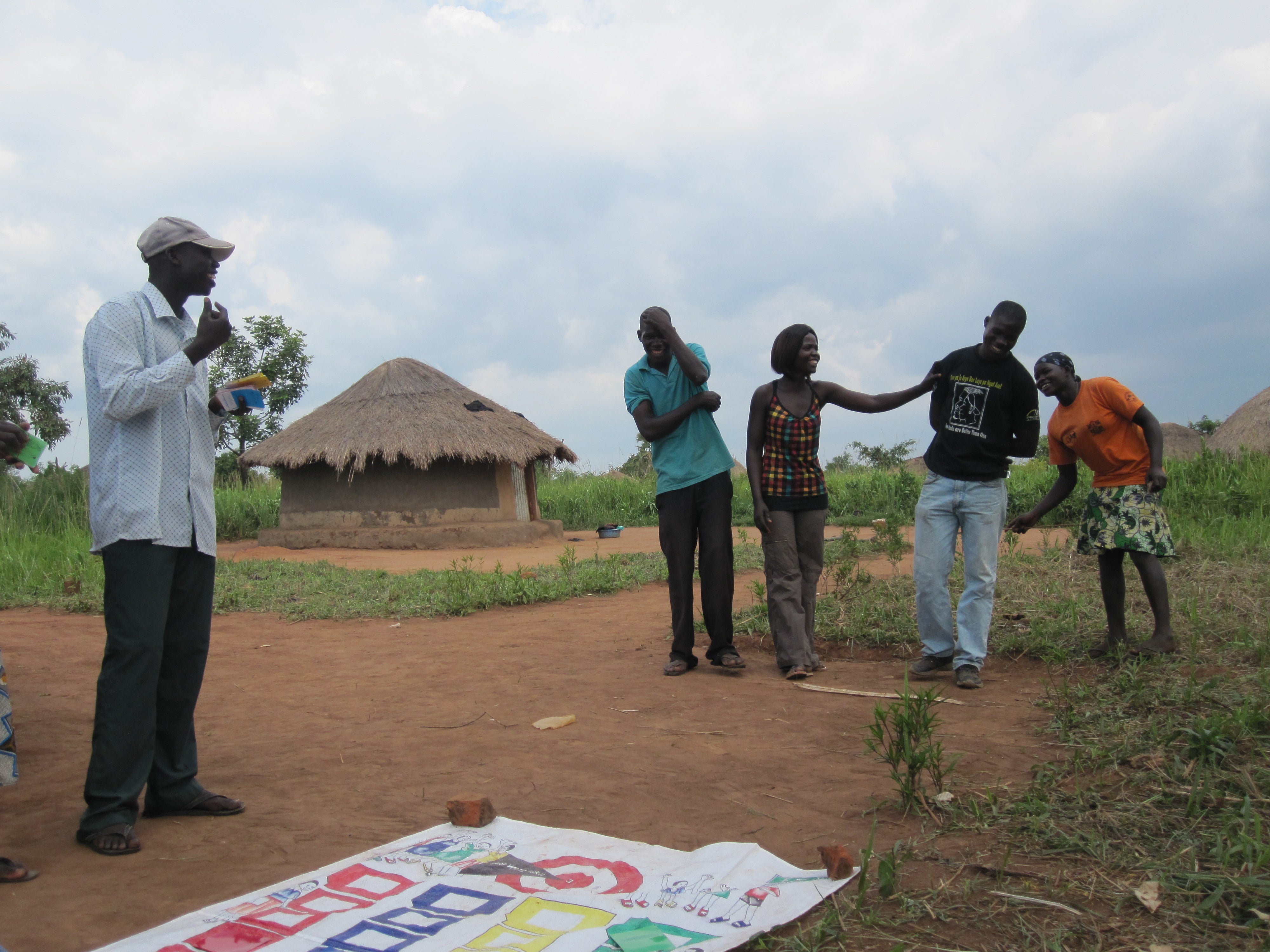 A group of older adolescents in Amuru, northern Uganda play the GREAT Community Game, which has been incorporated into their traditional dance club.